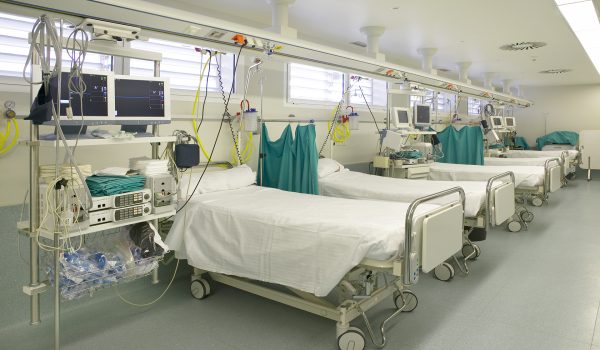 Hospital intensive care unit area with beds equipment. Health center